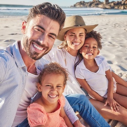 Invisalign patient in Nepean smiling with family